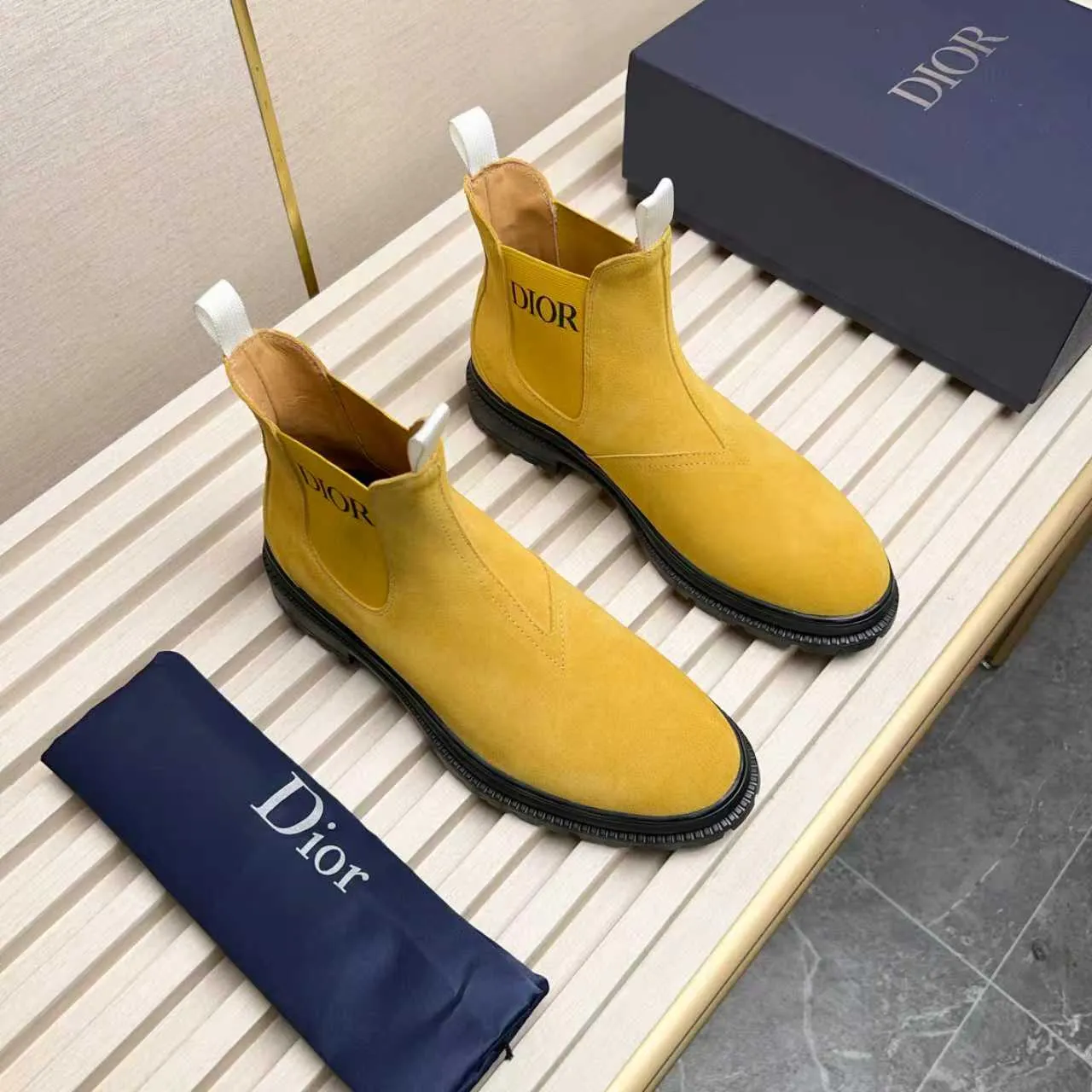 Men's Shoes 💰480 Dior A practical choice that combines protection with classic style. Made from durable Rugged Calf leather, it's tumbled and hand-finished to create a soft suede feel with a rich texture. Elastic side panels and subtle cutouts are inspired by the classic Chelsea boot. Leather upper and lining with Kummel tabs at front and rear, rubber outsole